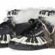 A PAIR OF BLACK AND WHITE 'PIANO' SNEAKERS - фото 1