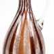Henkelkrug/Vase, 1930er Jahre, gebauchter Korpus aus farblosem Schaumglas mit vertikalen rotbraunen, streifenförmigen Einschmelzungen, ausgeschliffener Abriß, H. 27 cm - photo 1