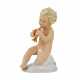 A figurine of a putti playing music on a pipe. - Foto 1