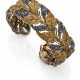 BUCCELLATI | Sapphire, gold and silver leaf shaped bangle bracelet, g 52.83 circa, diam. cm 6 circa. Signed Buccellati, 750. (slight defects) - фото 1