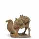 A PAINTED POTTERY FIGURE OF A KNEELING CAMEL - photo 1