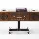 Radiophonograph model "RR126". Produced by Brionvega,, 1965. Veneered wood, removable speakers, anodised die-cast aluminium roller support. (61.5x92x37 cm.) (defects and restorations) - Foto 1