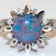 Opal-Brillant-Ring, 585er WG, blütenförmiger Ringkopf, mittig runde Opal-Doublette, umrandet von 8 Brillanten, von zus. 0,16 ct. (punziert), Ges.Gew. 3,7 g, RG 55 - photo 1