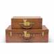 A GROUP OF TWO: A NATURAL COWHIDE LEATHER SUITCASE TRUNKS WITH BRASS HARDWARE - photo 1