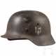 Stahlhelm M 35 des Heeres mit einem Abzeichen - photo 1