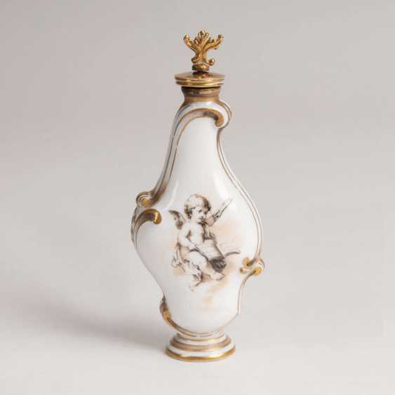 Porcelain perfume bottle with cherub Porcelain perfume bottle with cherub