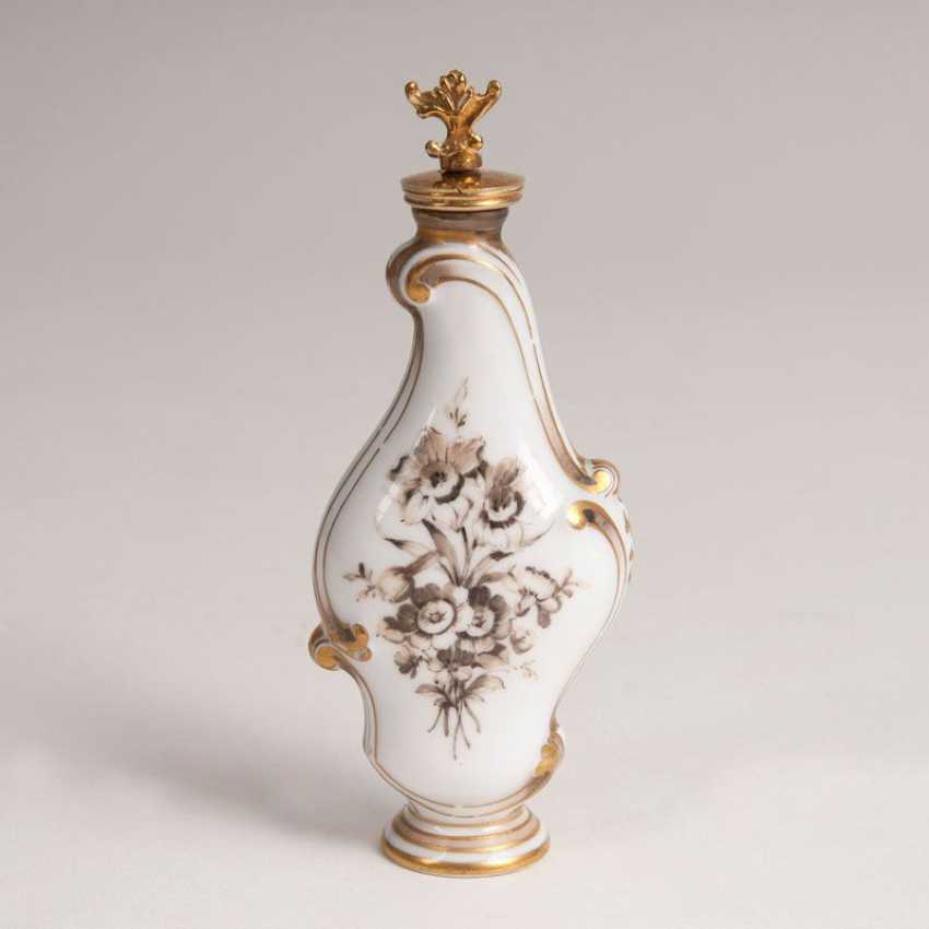 Porcelain perfume bottle with cherub Porcelain perfume bottle with cherub