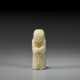 A SMALL PALE GREENISH-GREY JADE FIGURAL BEAD - фото 1