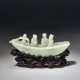 A SMALL PALE GREYISH-GREEN JADE CARVING OF FIGURES IN A BOAT - photo 1