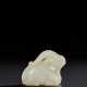 A RARE SMALL PALE GREENISH-WHITE JADE FIGURE OF A RECUMBENT RAM - photo 1