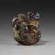 A GREY AND BROWN JADE CARVING OF A MYTHICAL BEAST SUPPORTED ON VAPOR - photo 1