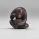 A CARVED WOOD NETSUKE OF A MONKEY - фото 1