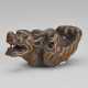 A CARVED WOOD NETSUKE OF A FLYING DRAGON - фото 1