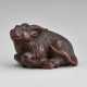 A CARVED WOOD NETSUKE OF A GOAT - фото 1