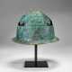 A PICENIAN BRONZE HELMET WITH LEATHER AND BASKETRY LINING - фото 1