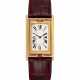 CARTIER. A RARE 18K GOLD LIMITED EDITION RECTANGULAR REVERSIBLE WRISTWATCH, MADE TO COMMEMORATE THE 150TH ANNIVERSARY OF CARTIER - фото 1