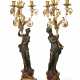 A PAIR OF LOUIS XVIII ORMOLU AND PATINATED BRONZE THREE-BRANCH CANDELABRA - фото 1