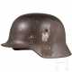 Stahlhelm M 35 des Heeres mit einem Abzeichen - photo 1