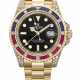 ROLEX. A RARE AND DAZZLING 18K GOLD, DIAMOND, RUBY AND SAPPHIRE-SET AUTOMATIC DUAL TIME WRISTWATCH WITH SWEEP CENTRE SECONDS, DATE AND BRACELET - photo 1