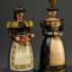 2 Diverse Lichterfiguren "Frauen in Tiroler Tracht mit Hut", farbig gefasst, am Fuß Manufakturstempel "Otto Dorén Rausdorf über Trittau", um 1920, H. 18/20cm, 1x Hut hinten beschädigt, 1x Korb fehlt, … - фото 1