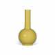 A YELLOW GLASS BOTTLE VASE - photo 1