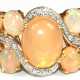 Opal-Brillant-Ring, 585er GG/WG, ausgefasst mit 9 ovalen Kristallopal-Cabochons und 10 kl. Brillanten von zus. ca. 0,05 ct., Ges.-Gew. 6,08 g, RG 63 (Wiederbeschaffungswert lt. Expertise 2.410,- €) - фото 1