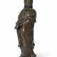 A SILVER-INLAID BRONZE FIGURE OF STANDING GUANYIN - photo 1