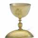 A CONTINENTAL SILVER-GILT DOUBLE-SIDED EGG CUP - фото 1