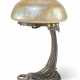 AN AUSTRIAN PATINATED BRONZE AND IRIDESCENT GLASS TABLE LAMP - фото 1