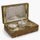 A travel set in a suitcase with silver items - photo 1