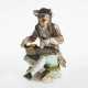 A figure of a beggar with a hurdy-gurdy - photo 1