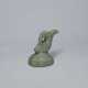 A CELADON STONEWARE SEAL WITH A FISH - Foto 1