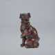 A CARVED WOOD NETSUKE OF A SEATED EUROPEAN DOG - фото 1