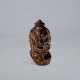 A LACQUERED AND CARVED WOOD NETSUKE OF HEAD OF A NIO - photo 1