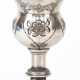 Fußbecher, 700er Silber, aufgewölbter Rundfuß mit Ornamentdekor in gegliederten Schaft übergehend (alt repariert), Kuppa mit Floraldekor , Gew. 68,5 g, H. 13,5 cm - photo 1