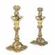 A PAIR OF GEORGE V SILVER-GILT CANDLESTICKS, AFTER A MODEL BY PAUL DE LAMERIE - photo 1