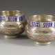 A PAIR OF SILVER AND CHAMPLEVÉ ENAMEL SALTS - photo 1