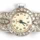 Art Deco-Damenarmbanduhr "Elgin", 900er Platin Gehäuse mit reichlich Diamanten besetzt, 1,5x4,2 cm, 585er WG-Armband mit Sicherheitskettchen, L. 17 cm, Ges.-Gew. 13,5 g, nicht funktionstüchtig - photo 1