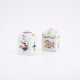 TWO RECTANGULAR PORCELAIN TEA CADDIES WITH TWISTED RELIEF AND FLORAL RESP. FRUIT DECOR - photo 1