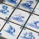 9 Diverse Fliesen mit Unterglasurblauer Malerei "Seenymphen", "Meeresunwesen", "Delphin" und "Wal", 4x Eckbemalung Rosetten, 3x Spinne, 2x Ochsenköpfe mit Dreistrahl, Holland 3. Dr… - photo 1