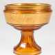 Art-Deco-Fußschale, Moser, bernsteinfarbenes Glas mit Goldbemalung, Schale mit goldener Reliefbordüre mit Wein- und Vogeldekor, Gold partiell berieben, H. 19 cm, Dm. 19 cm - photo 1