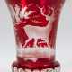 Becherglas, Böhmen, rot überfangen, umlaufend mit geschnittenem Wildmotiv, H. 12 cm - photo 1