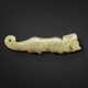 A GREYISH-GREEN JADE TIGER PENDANT - photo 1