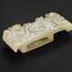A RARE AND FINELY CARVED PALE GREYISH-WHITE AND BEIGE JADE SCABBARD SLIDE - photo 1