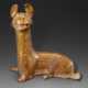 A LARGE AMBER-GLAZED RED POTTERY FIGURE OF A RECUMBENT DOG - photo 1