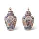 A PAIR OF JAPANESE PORCELAIN IMARI 'TEMPLE' JARS AND COVERS - photo 1