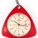 Taschenuhr "Ruhla", DDR um 1970, im roten Dreiecksgehäuse aus Plaste, Handaufzug, helles rundes Zifferblatt mit arabischen Zahlen und Stabindizes, zentraler Sekunde und Datumsangabe, gangfähig, 4,8x4,8 cm, an A… - photo 1