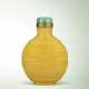 AN IMPERIAL CARVED YELLOW GLASS ‘DRAGON AND PHOENIX’ SNUFF BOTTLE - photo 1
