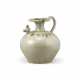 A YUE CELADON IRON-SPOTTED 'CHICKEN-HEAD' EWER - photo 1 A YUE CELADON IRON-SPOTTED 'CHICKEN-HEAD' EWER - photo 1