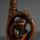 Wooden netsuke ‘Monkey in eagle's claw’ with inlai… - photo 1